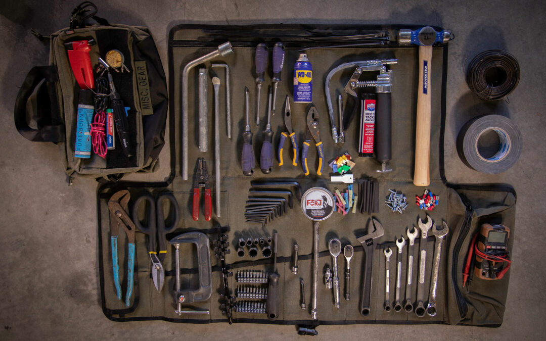 Overland Tool Kit laying on the floor of a garage